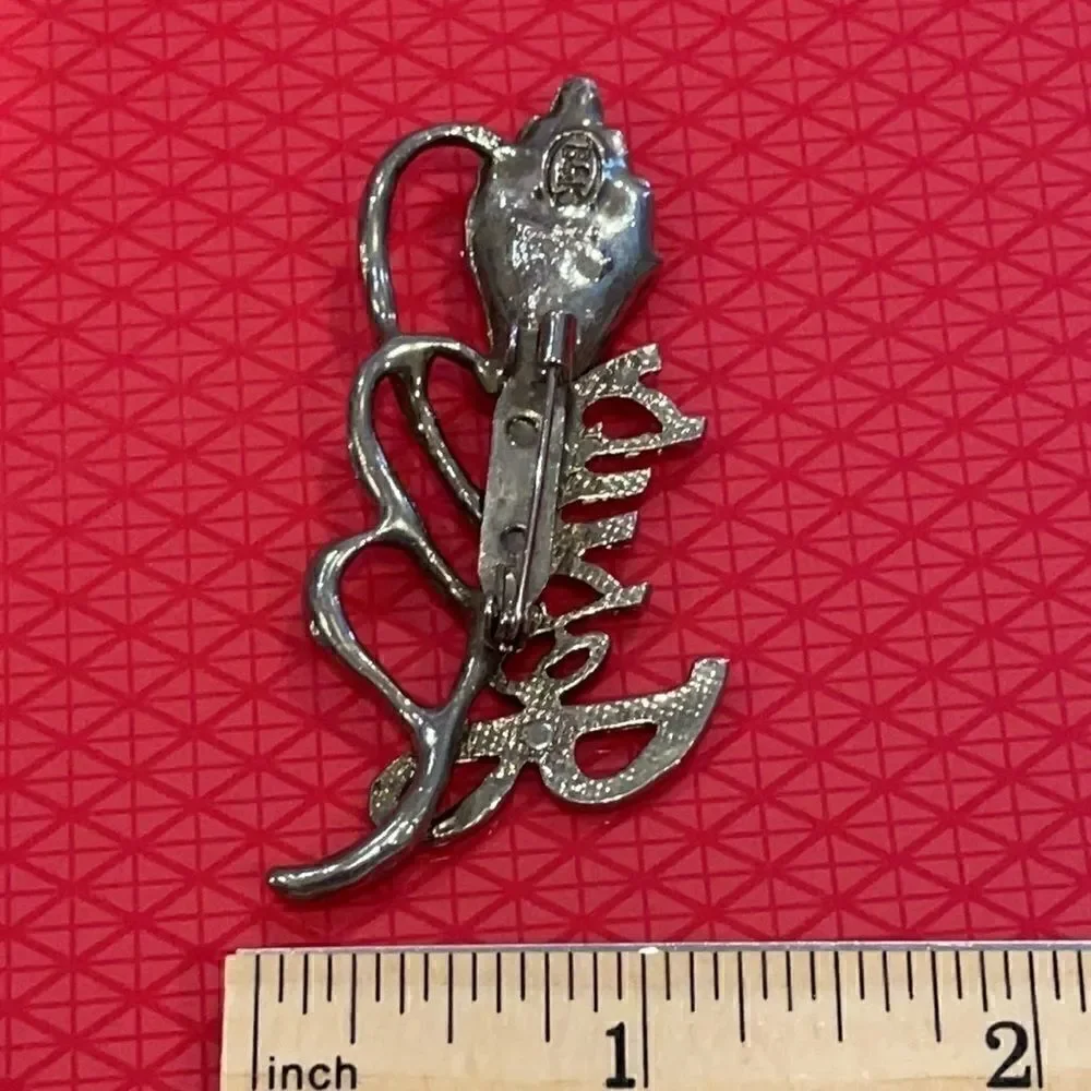 Vintage signed BSK Jesus flower silver-tone brooch